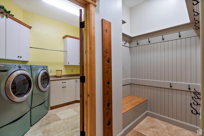 Laundry area featuring separate washer and dryer and cabinet space | Image 43