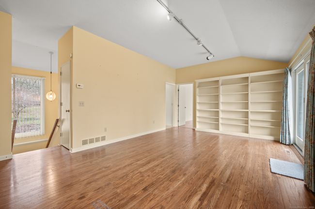 Dining Room/Den with stairs to Bedrooms and Lower Level. | Image 11