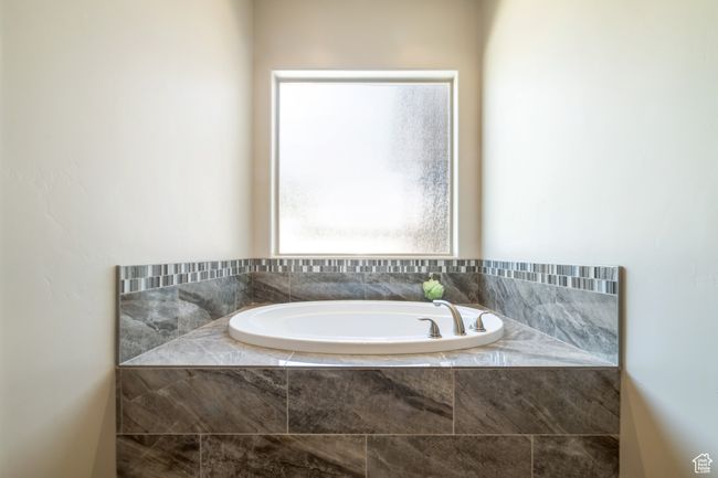 Bathroom featuring a bath and plenty of natural light | Image 18