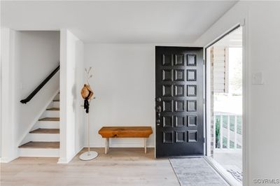 Entrance foyer featuring plenty of natural light and light hardwood / wood-style flooring | Image 2