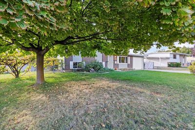 View of front facade with a front lawn | Image 3