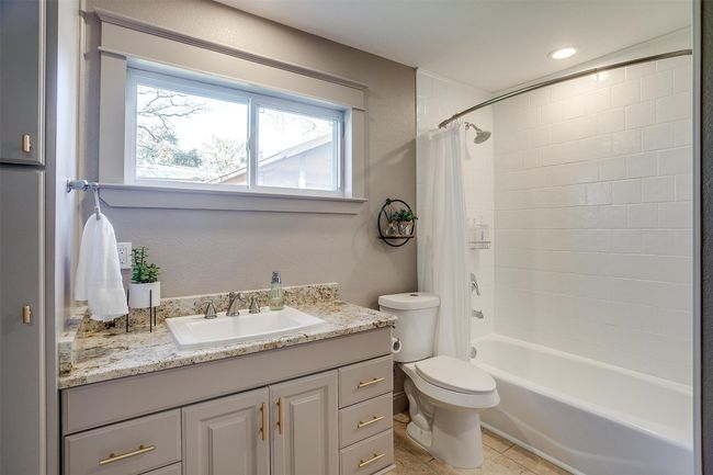 Full bath with toilet, shower / tub combo, and vanity | Image 24