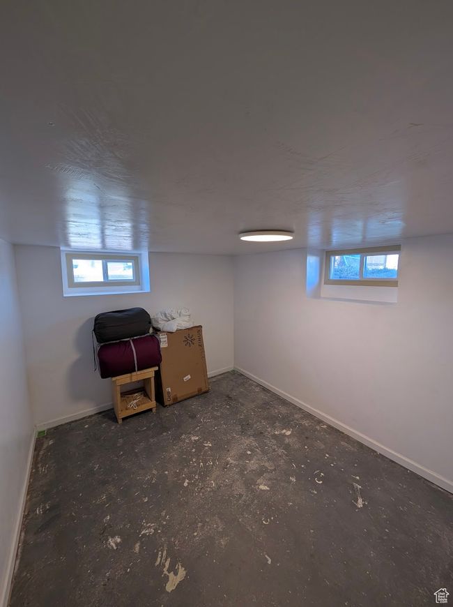 Basement featuring baseboards | Image 8