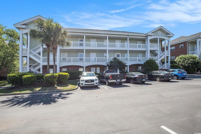 View of building exterior with uncovered parking and stairway | Image 20