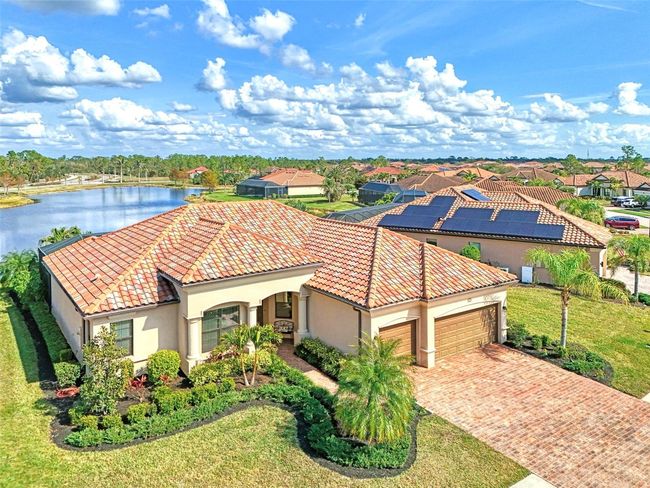 Aerial View of House on Lake | Image 9