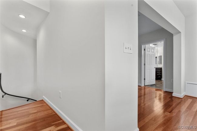 Hall with wood-type flooring, baseboards, and recessed lighting | Image 23