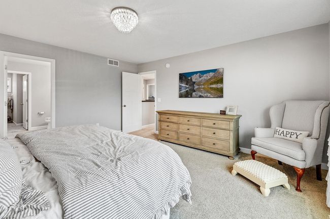 retreat to the spacious primary suite with a luxurious en-suite bath and a huge walk-in closet. | Image 25