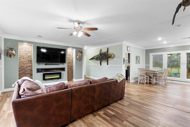 Family room, hallway to other 2 bedrooms and door to laundry/mudroom | Image 6
