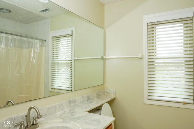 full bathroom, vanity, and a shower with curtain | Image 23