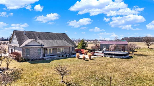 Enjoy the covered back patio, open patio and the pool this summer. | Image 61