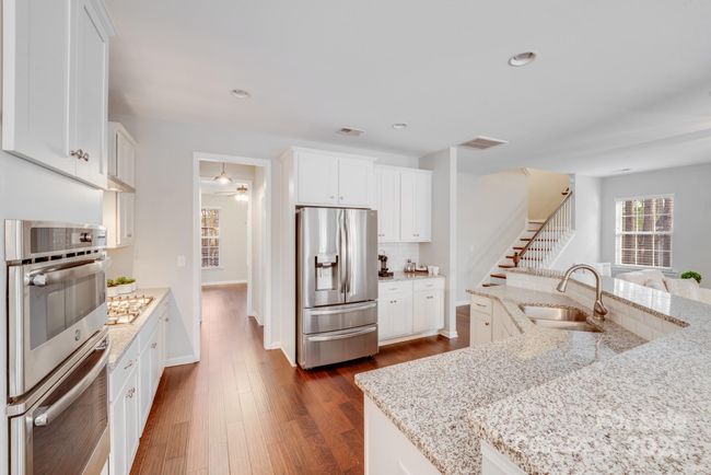 Kitchen boasts two pantries in space between kitchen and dining room. | Image 21