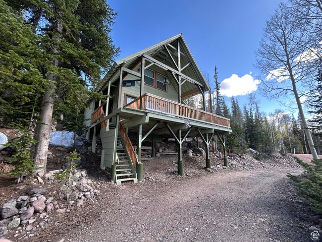 View of front of house featuring stairs and a deck | Image 8