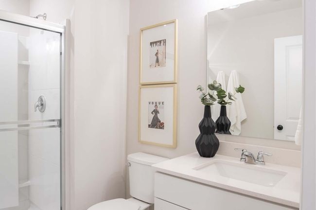 The finished lower level includes a stylish bathroom, featuring modern fixtures and thoughtful design. Photos are from previously built home; features and options will vary. | Image 26