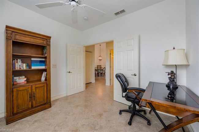 Office area featuring ceiling fan | Image 20
