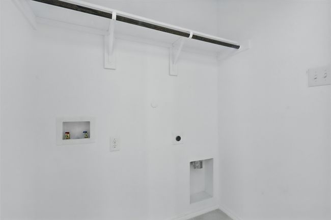Laundry room featuring electric dryer hookup, hookup for a washing machine, and laundry area | Image 9