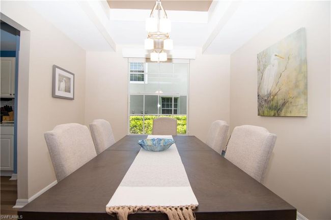 Room for 8 in this large formal dining room with tray ceiling. | Image 17