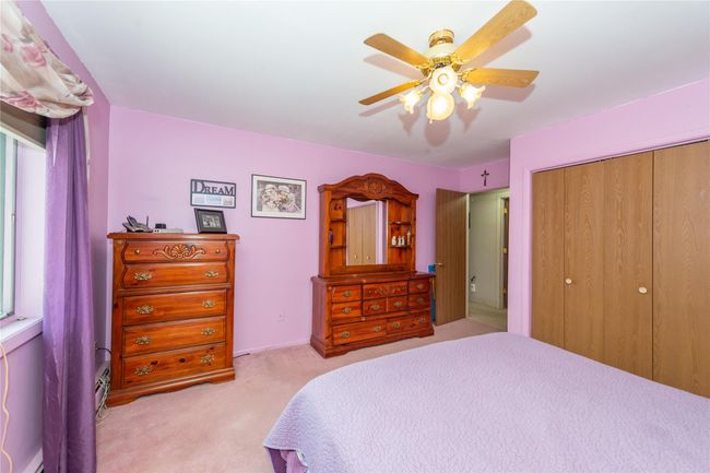 Bedroom featuring ceiling fan, a closet, and carpet | Image 22