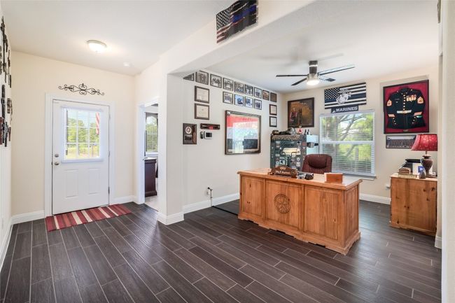 Hardwood look tile, open floor plan. | Image 8