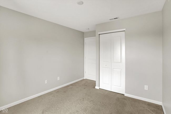 carpeted second bedroom. Rough in for ceiling fan/overhead lighting | Image 29