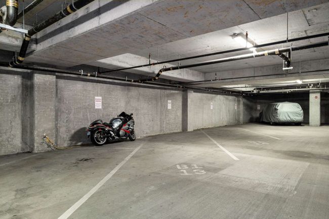 Enjoy the ease of an assigned parking space on the coveted first floor within the owners' gated section of the parking garage. | Image 41
