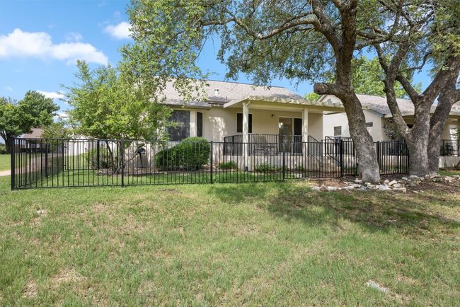 View of rear of house featuring stucco siding | Image 28