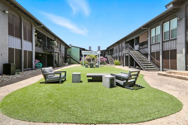 View of property's community with stairway and a yard | Image 19