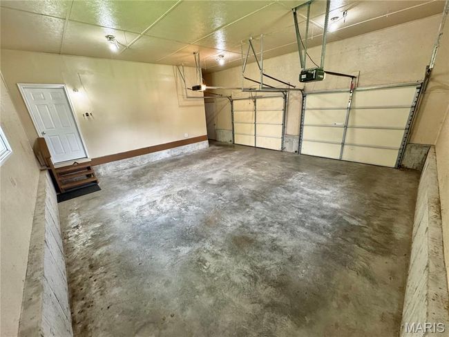 Garage with a garage door opener | Image 38