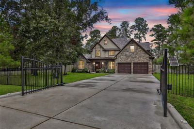 Welcome home! Automatic gates and fully fenced front yard. | Image 1