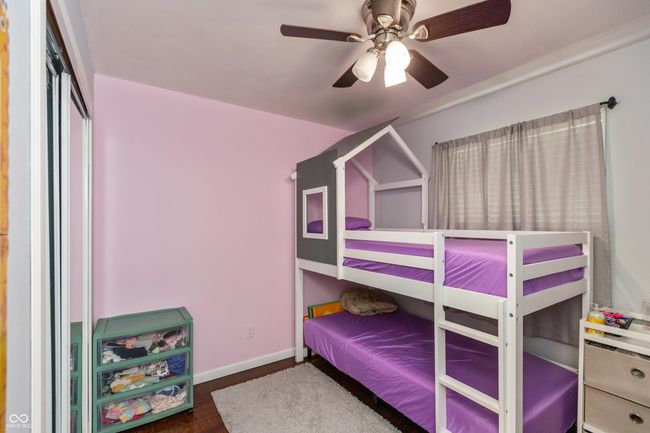 bedroom featuring wood finished floors and ceiling fan | Image 17