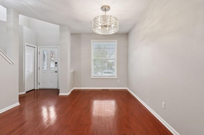 Spacious dining area with modern lighting | Image 4