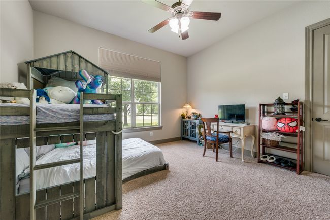 Bedroom featuring carpet and ceiling fan | Image 36