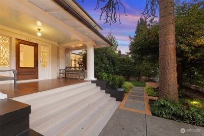 Gracious front porch with beautiful wood floors. | Image 2