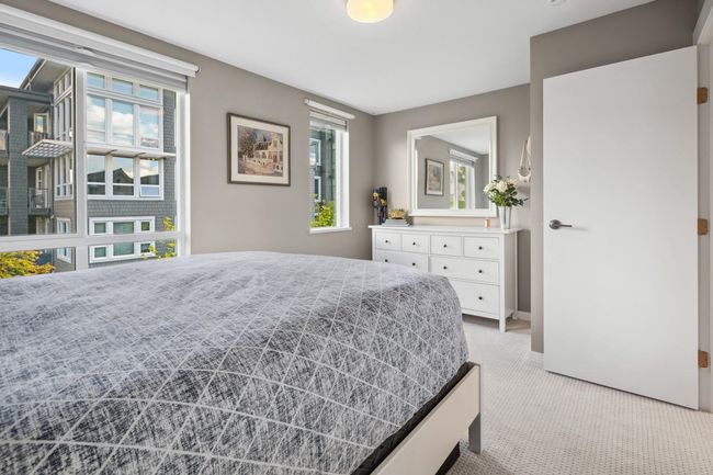 Bedroom with light carpet, multiple windows, and baseboards | Image 23