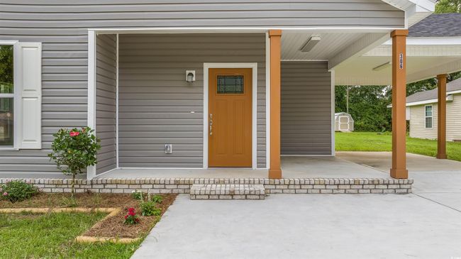 Entrance to property featuring roof with shingles | Image 4