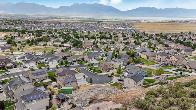 Aerial overview of property's location featuring mountains and nearby suburban area | Image 5