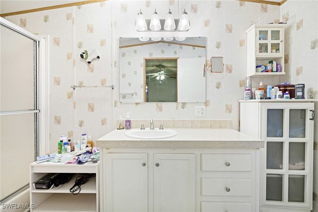 Primary bath with upgraded ceramic sinks and large walk in shower. | Image 12