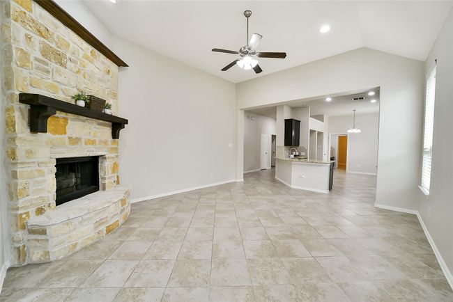 Let's head back to the heart of the home and see the other living spaces. To the left of the kitchen breakfast bar are two secondary bedrooms, another full bath AND a flex space. | Image 20