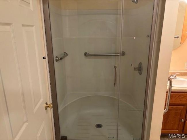 Bathroom featuring a shower stall and vanity | Image 27