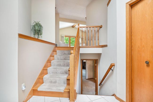 Main level garage and front door entry. Welcome Home! | Image 14