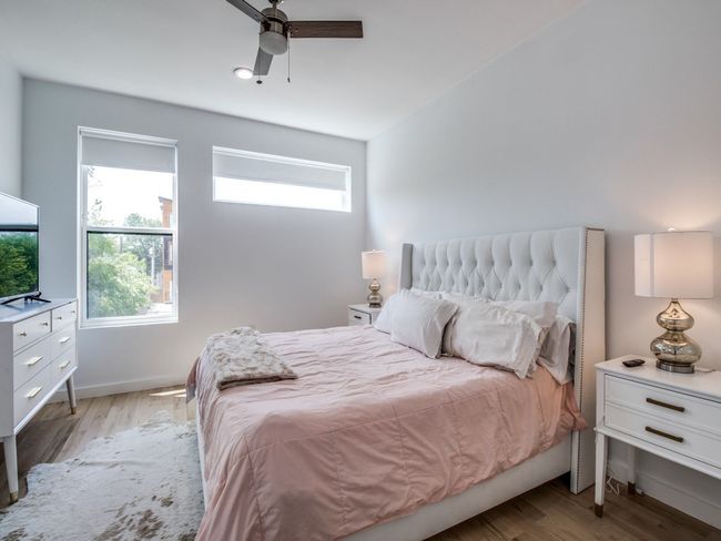 Bedroom featuring light wood-style floors and ceiling fan | Image 19