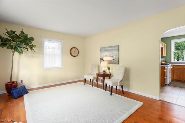 Living area featuring light hardwood floors | Image 12