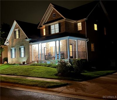 View of front facade featuring a yard and covered porch | Image 3