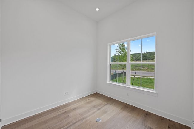 Unfurnished room featuring baseboards, light wood-style flooring, and recessed lighting | Image 28