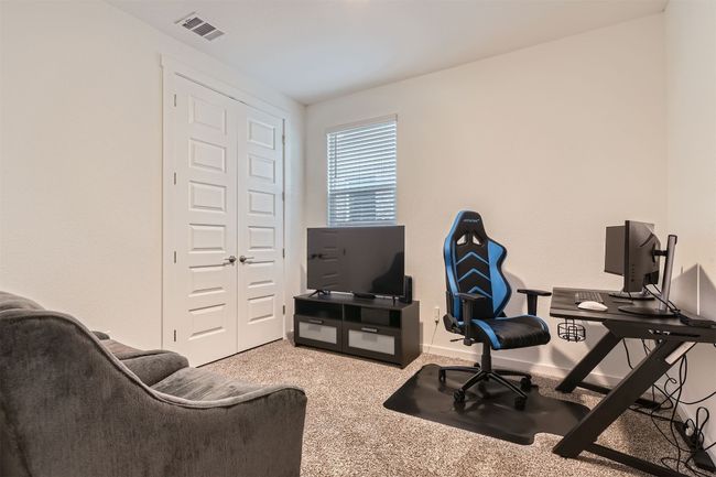 Carpeted home office featuring visible vents | Image 20