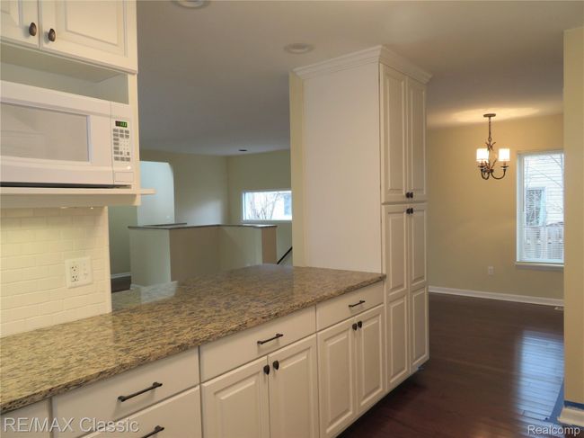 Enjoy the spacious work area and large pass through that goes into the great room. | Image 6