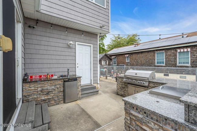 Step outside, where you have an outdoor kitchen | Image 39