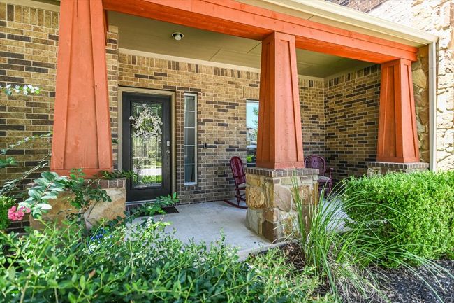Shaded front porch affords a rocking porch view of the neighborhood. | Image 4