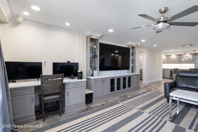 Built in desk area, built in entertainment center with stereo and surround speakers, thorugh out appartment | Image 19