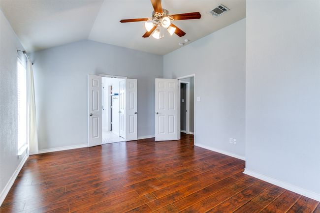 Looking toward the primary bathroom - and yup, that wall could definitely handle a big dresser or television (or both)! | Image 19