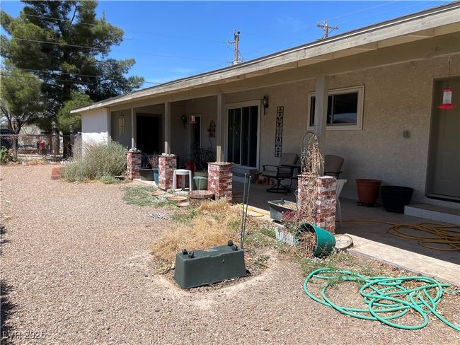 Back of property featuring a patio area, stucco siding, and fence | Image 8